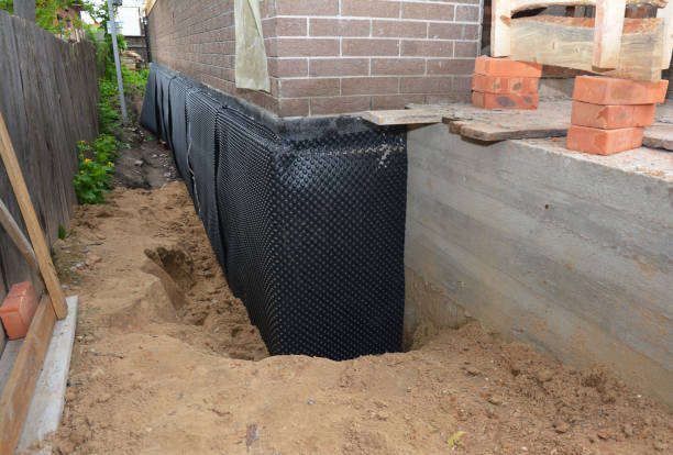 SJ Waterproofing Pros technician performing targeted Interior Drainage System assessment in Mount Airy, NC